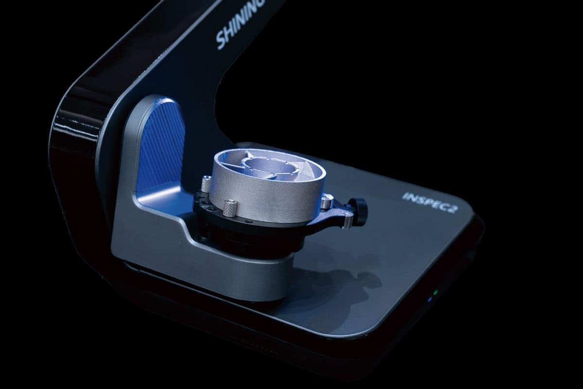 AutoScan Inspec2 3-axis turntable holding a machined part